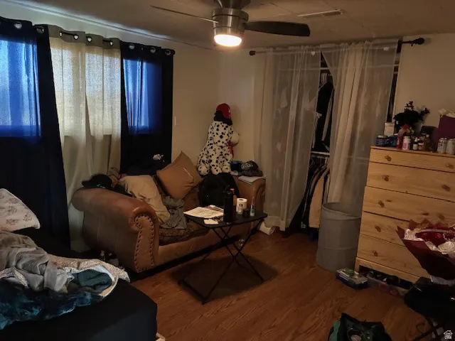 Bedroom with wood finished floors and ceiling fan