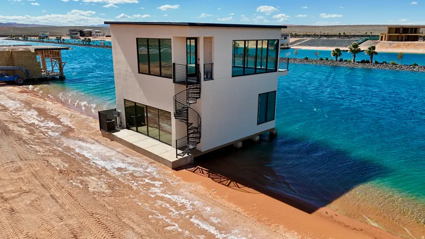 Dock area with view of water and beach