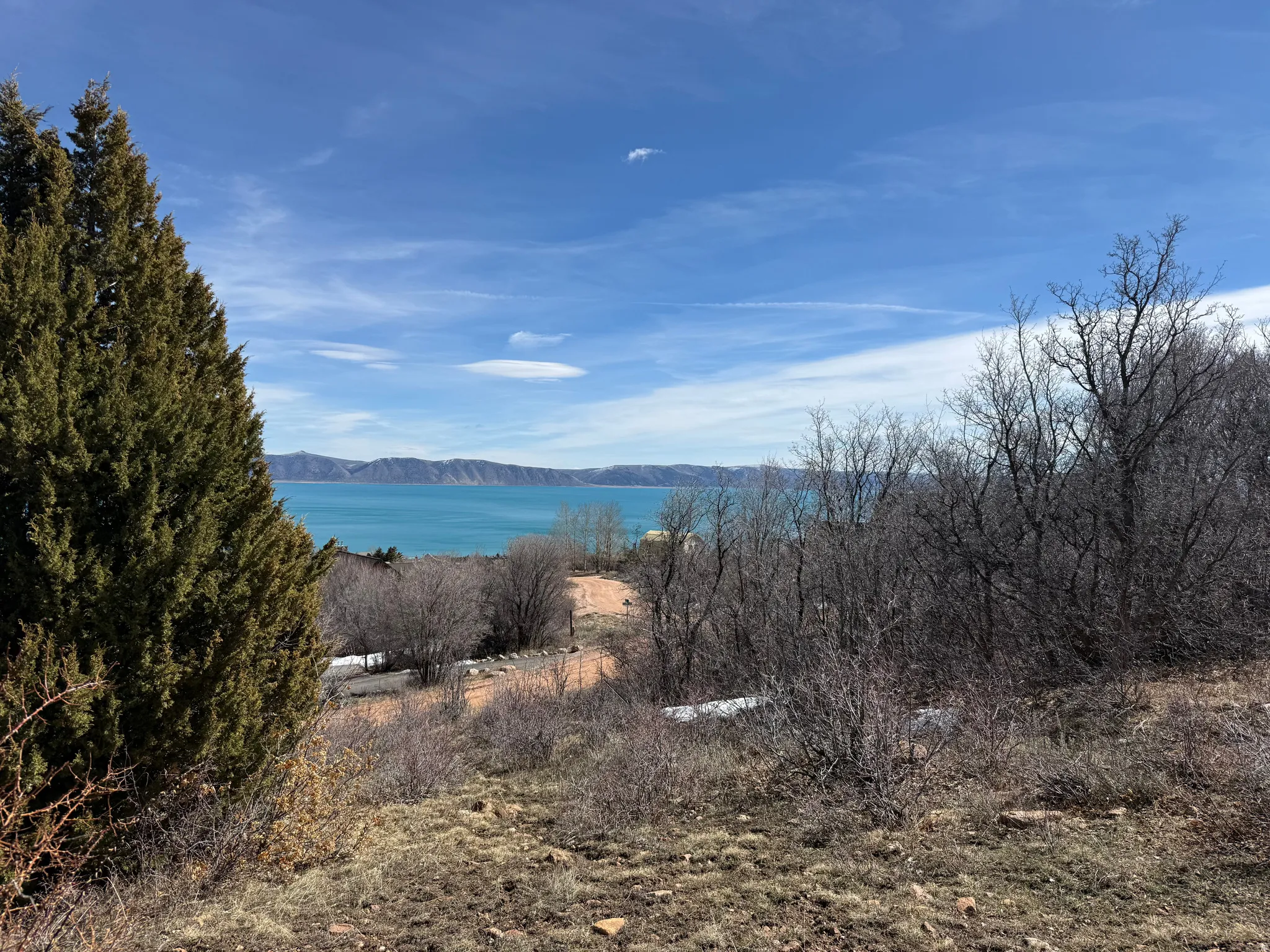 View of mountain backdrop with a nearby body of water