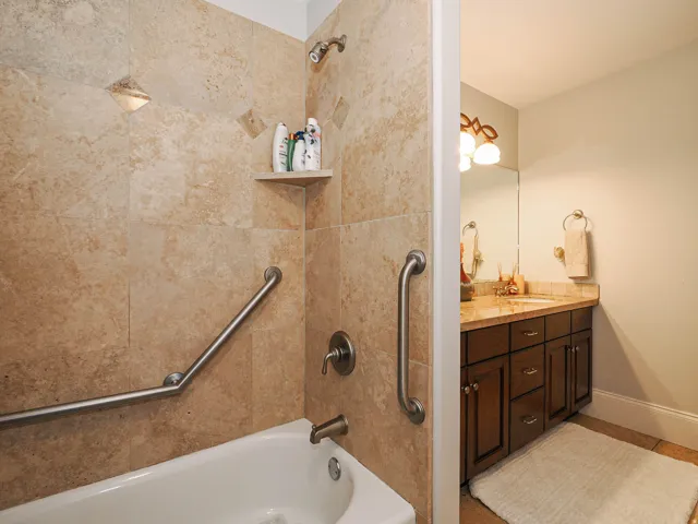 Full bathroom featuring vanity and shower / bath combination