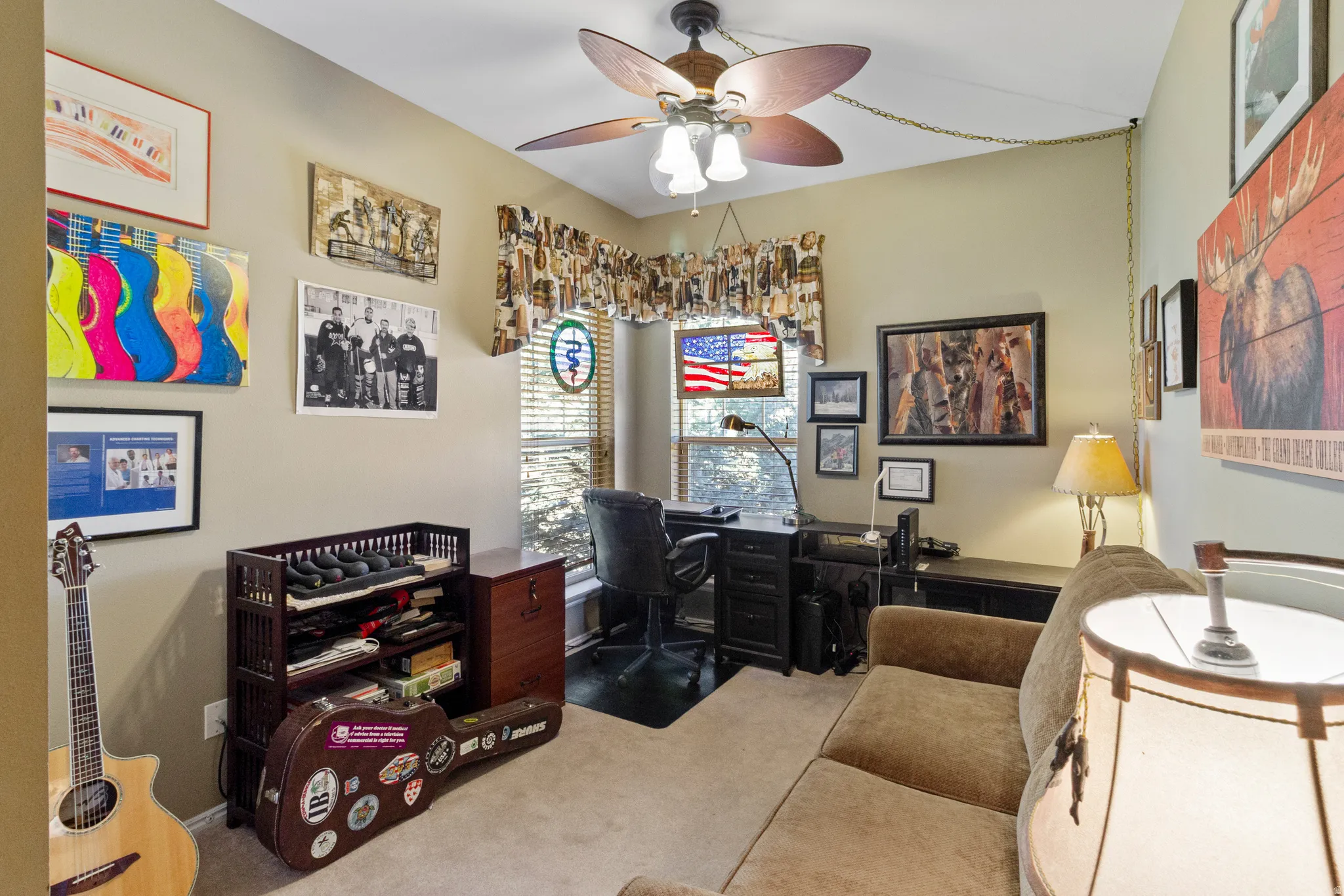 Office area featuring carpet flooring and a ceiling fan
