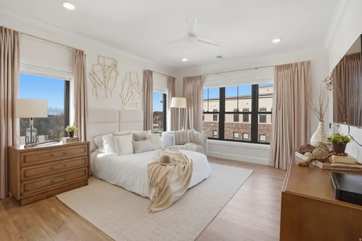 Primary Bedroom with ensuite bathroom, walk in closet, and private door to balcony