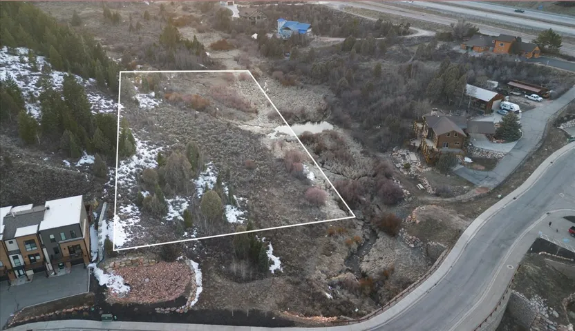 View of property location featuring property parcel outlined and nearby suburban area