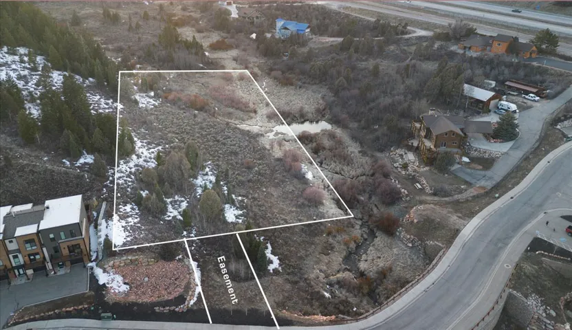 View of property location featuring property boundaries highlighted and nearby suburban area