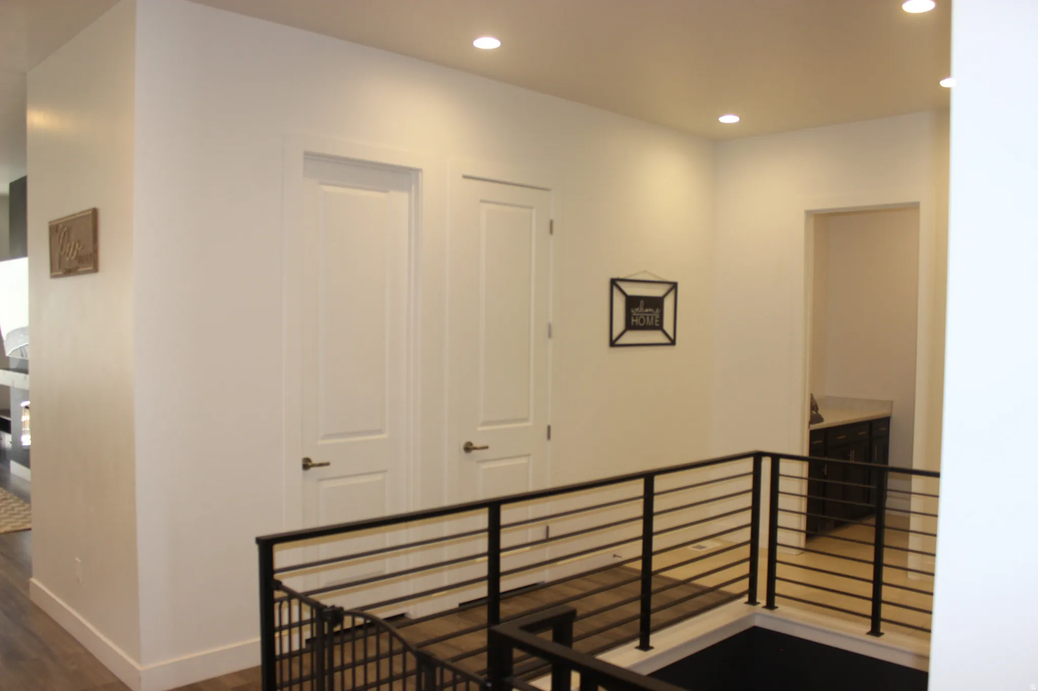 Stairway featuring recessed lighting and wood finished floors