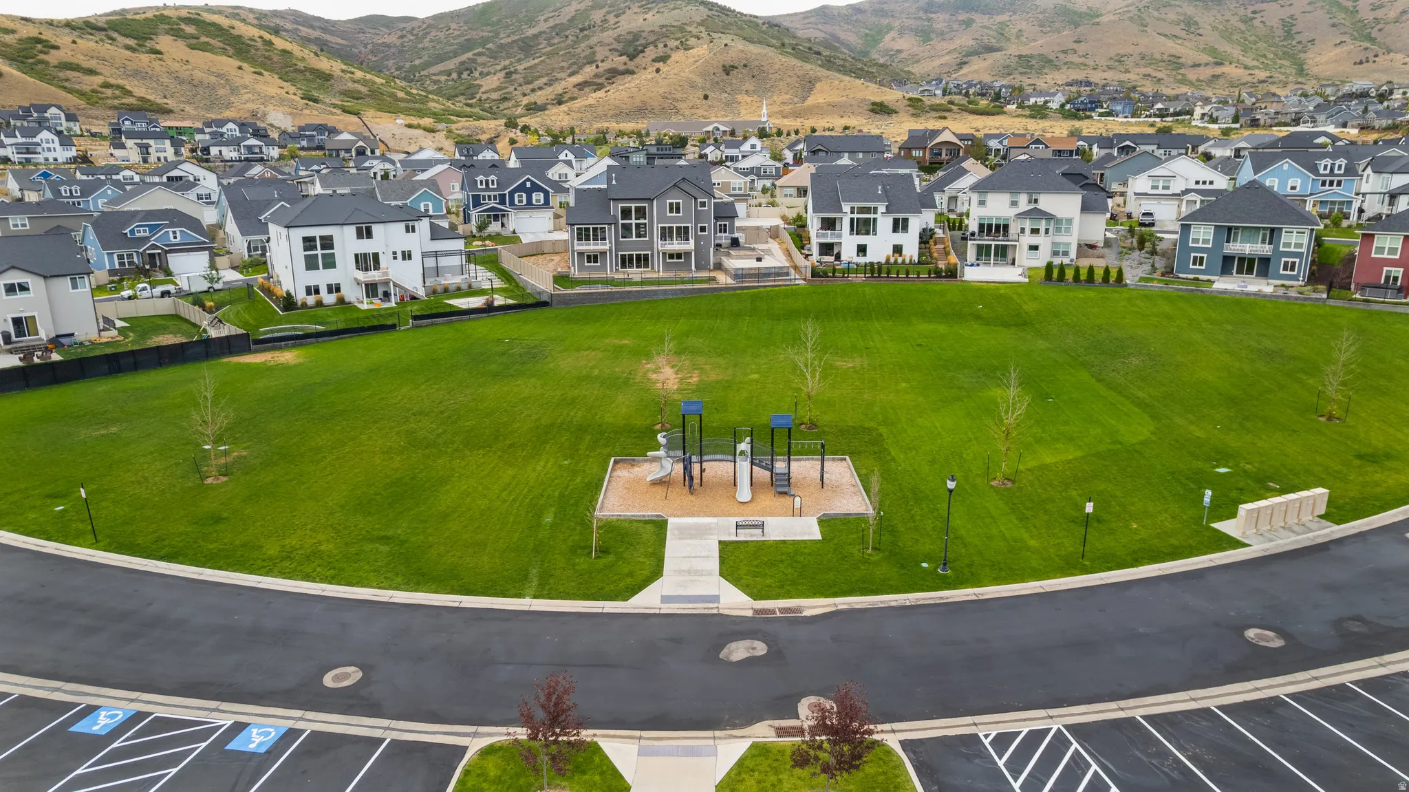 Aerial perspective of suburban area featuring a mountain backdrop