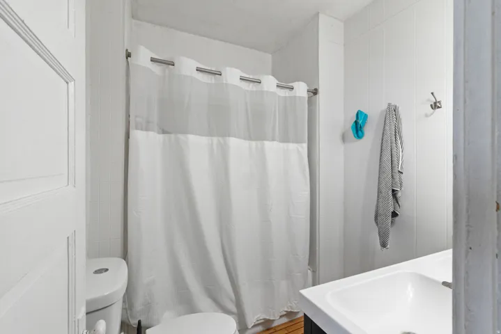 Bathroom with shower / tub combo and vanity