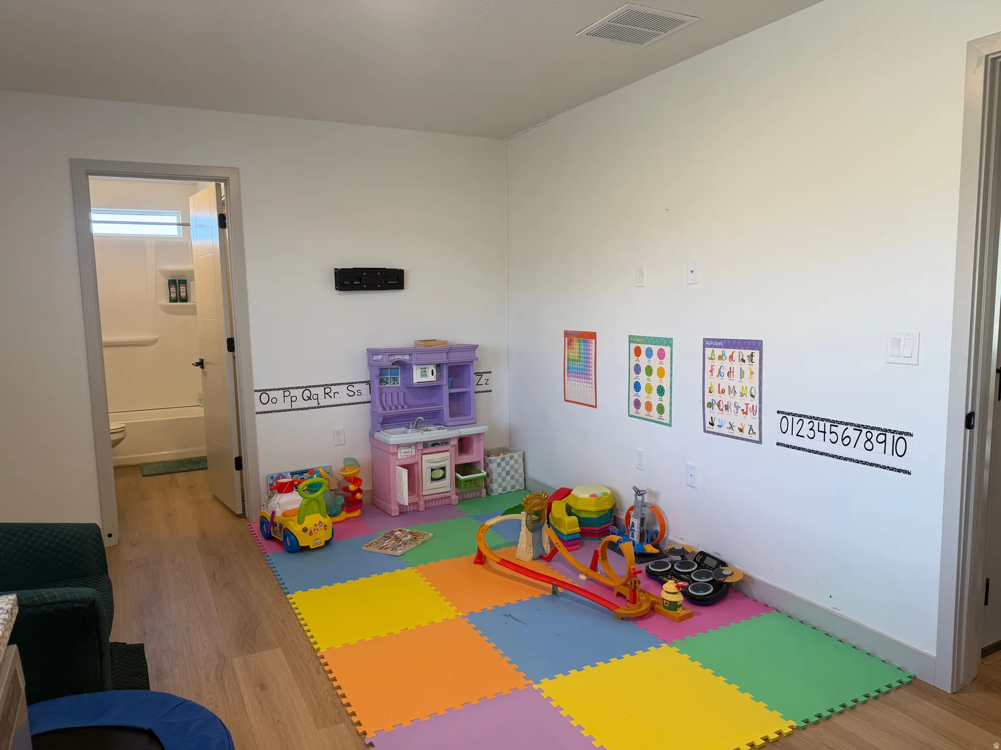 Game room featuring light wood-type flooring