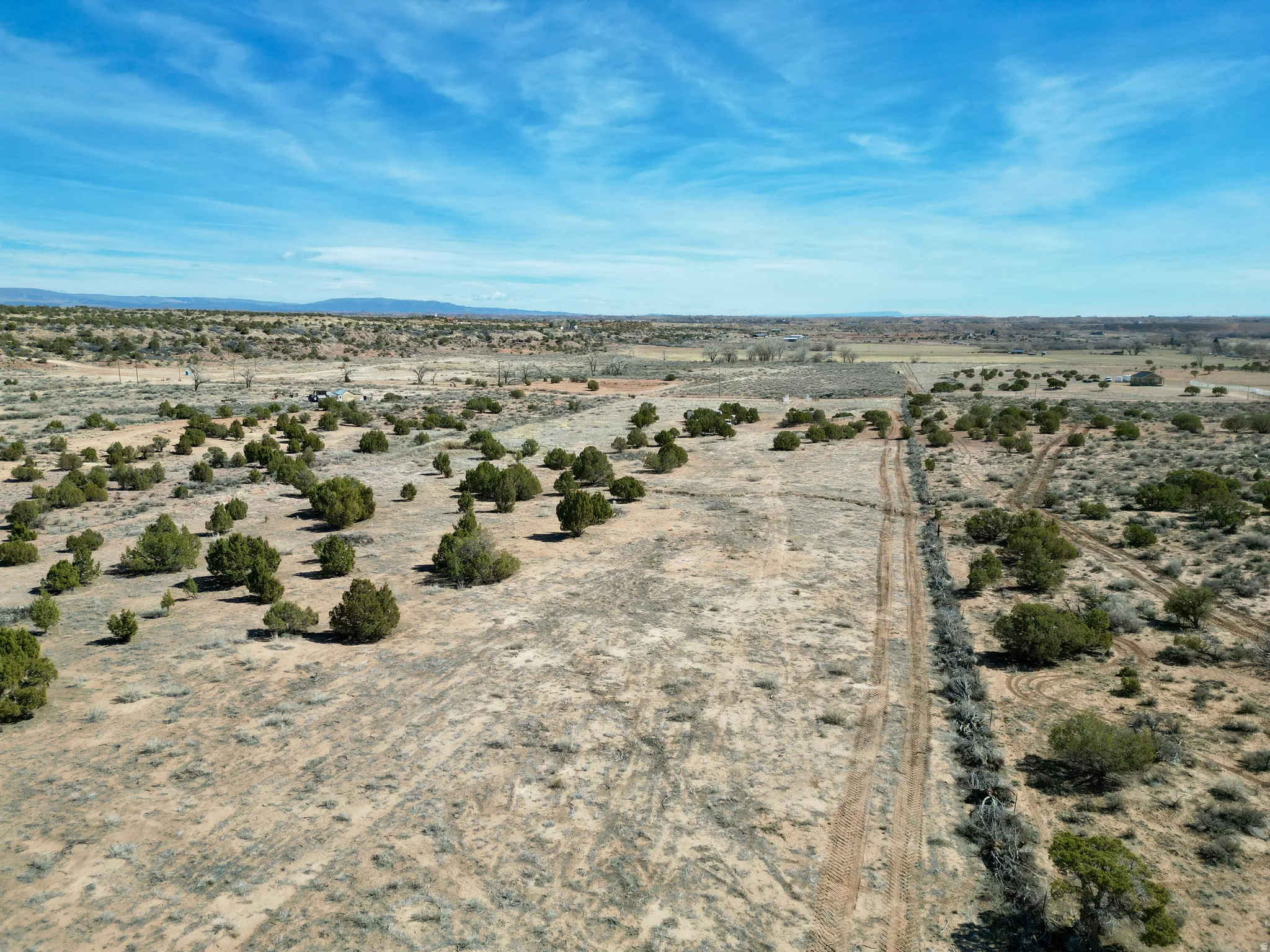 View of rural area with a desert landscape and mountains
