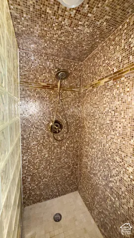 Bathroom featuring a shower stall