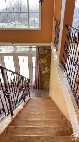Stairs featuring a high ceiling