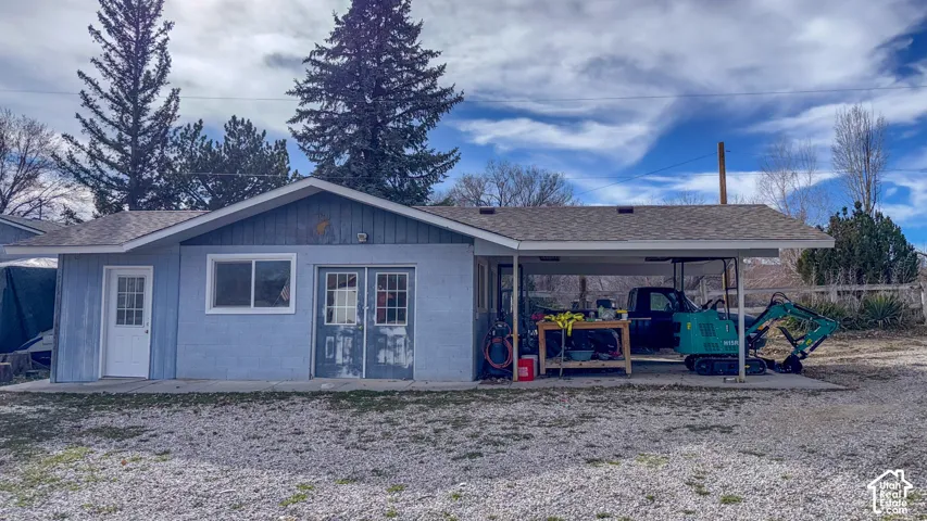 View of outdoor structure with a carport