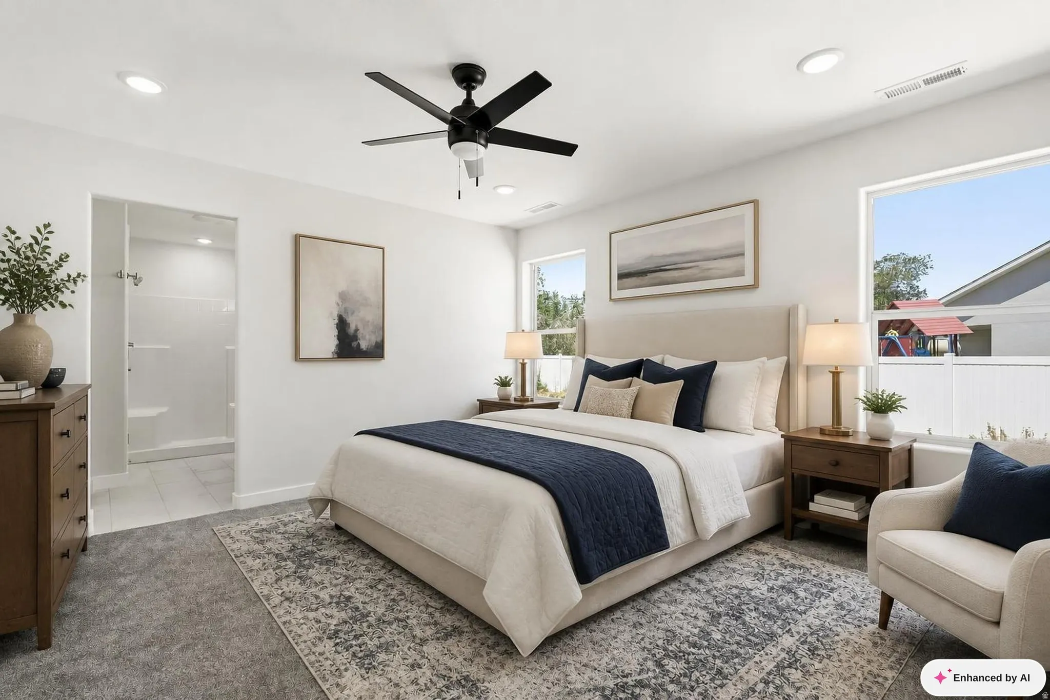 Recessed lighting, ceiling fan, two windows, and an en-suite shower