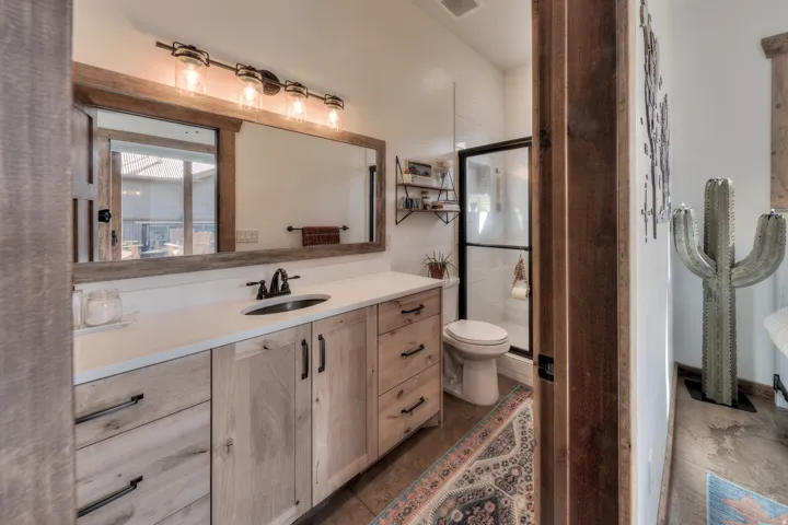 Full bath featuring vanity and a stall shower