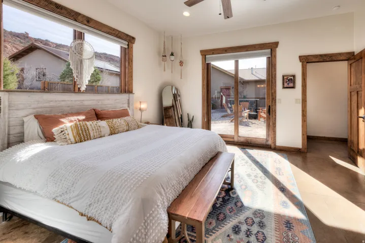 Bedroom featuring access to outside, a ceiling fan, and recessed lighting