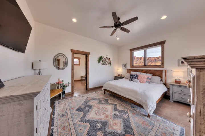 Bedroom with a ceiling fan and recessed lighting