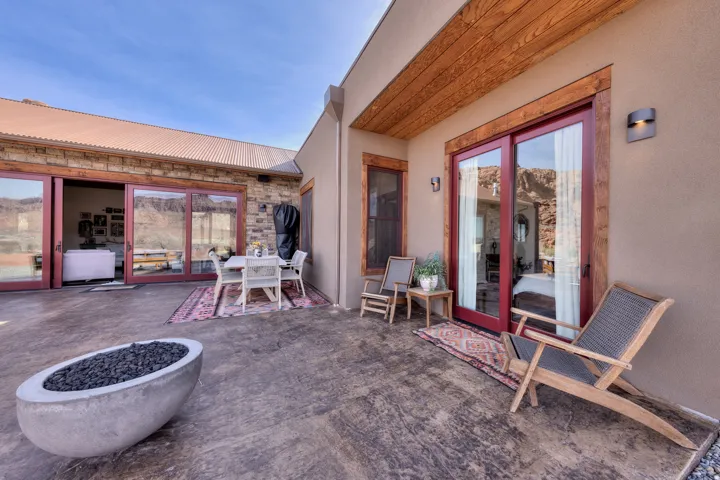 View of patio / terrace featuring outdoor dining area and an outdoor fire pit