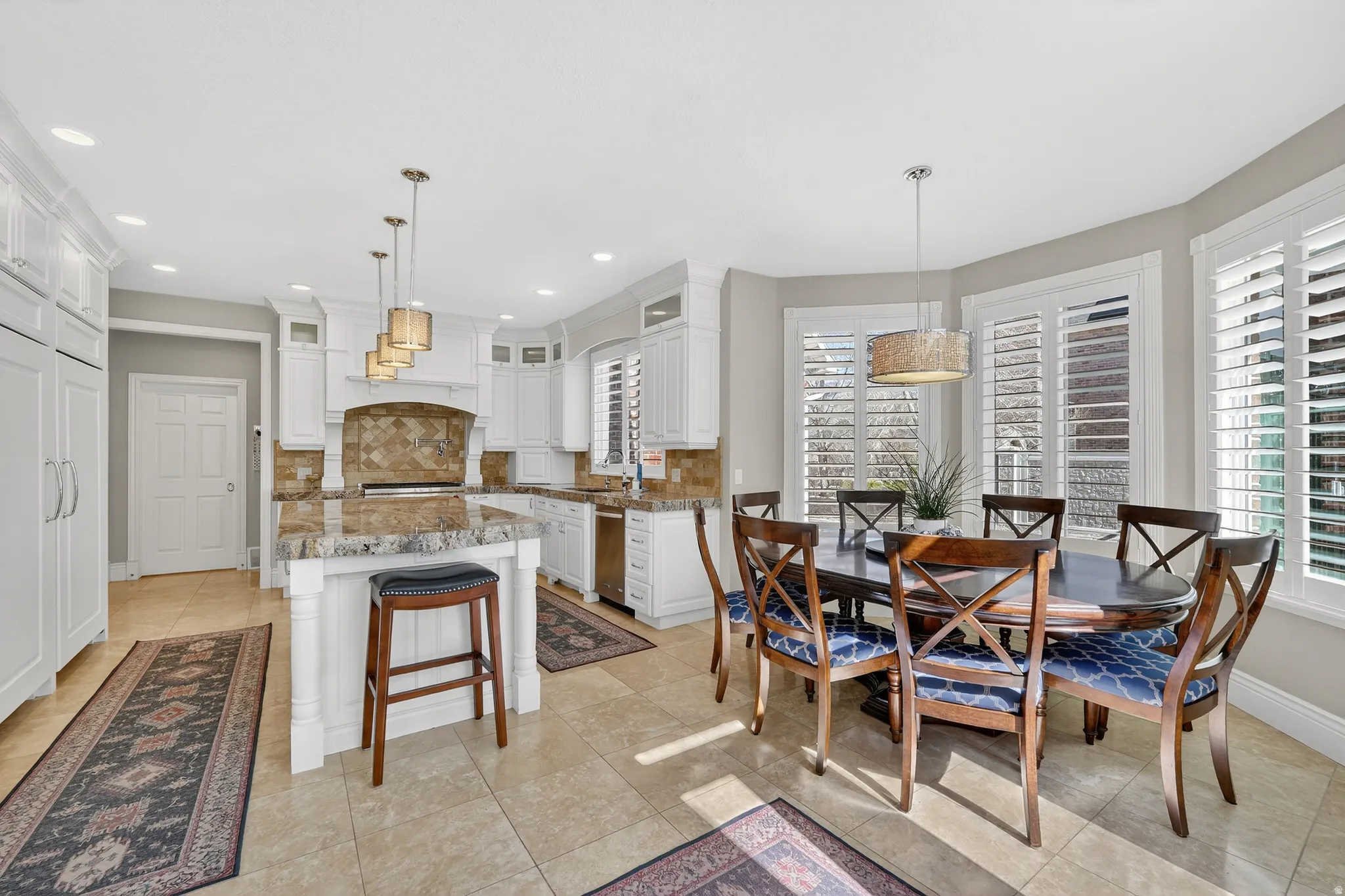 Dining space featuring recessed lighting and light tile patterned flooring