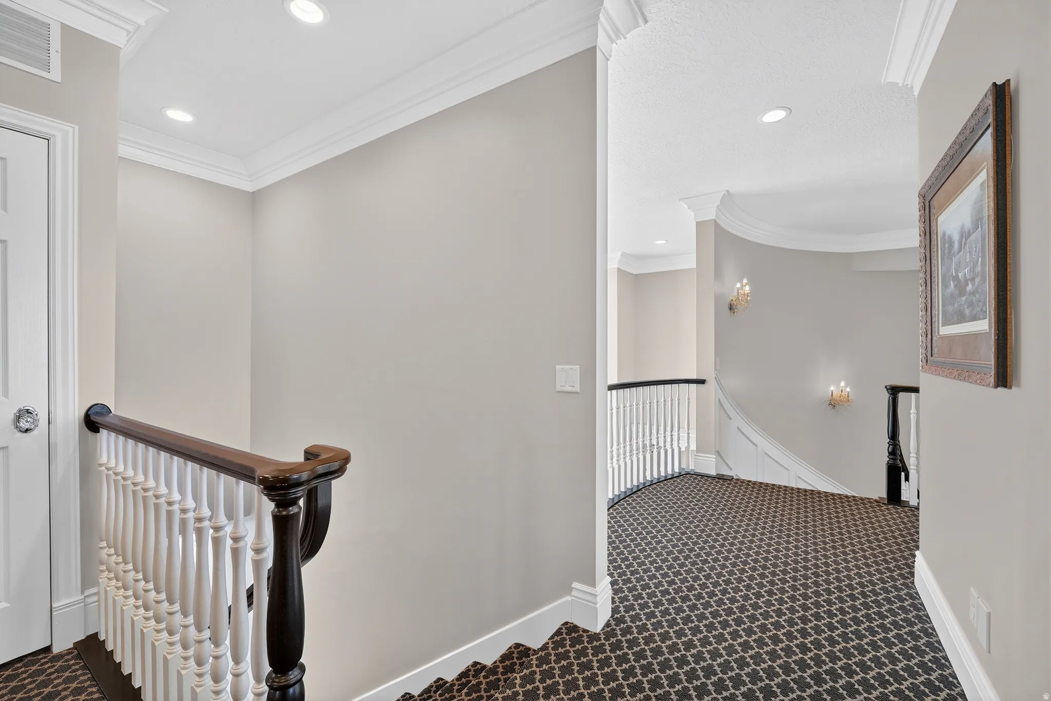 Stairs with ornamental molding, carpet flooring, and recessed lighting