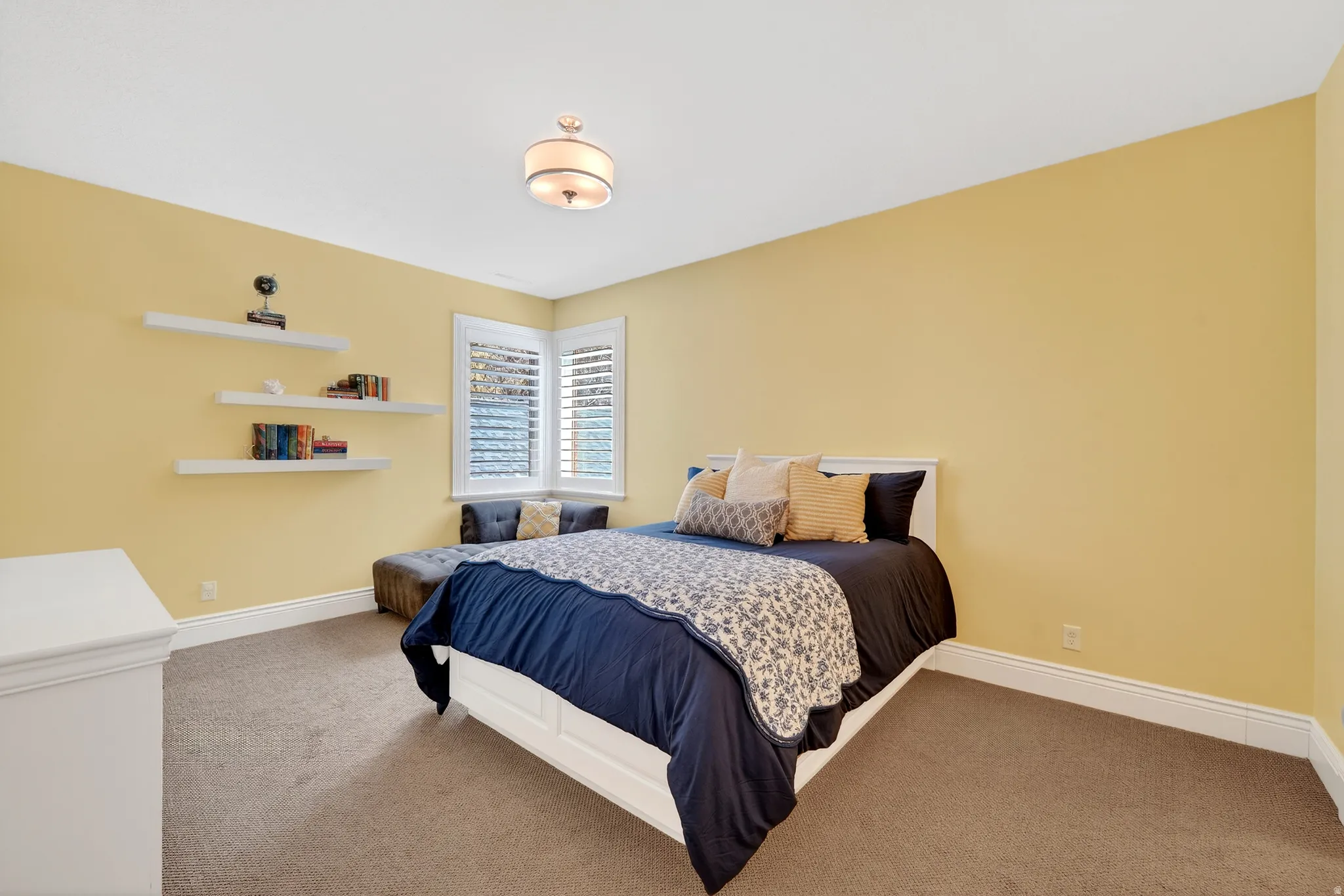 Bedroom with corner windows and en-suite bathroom