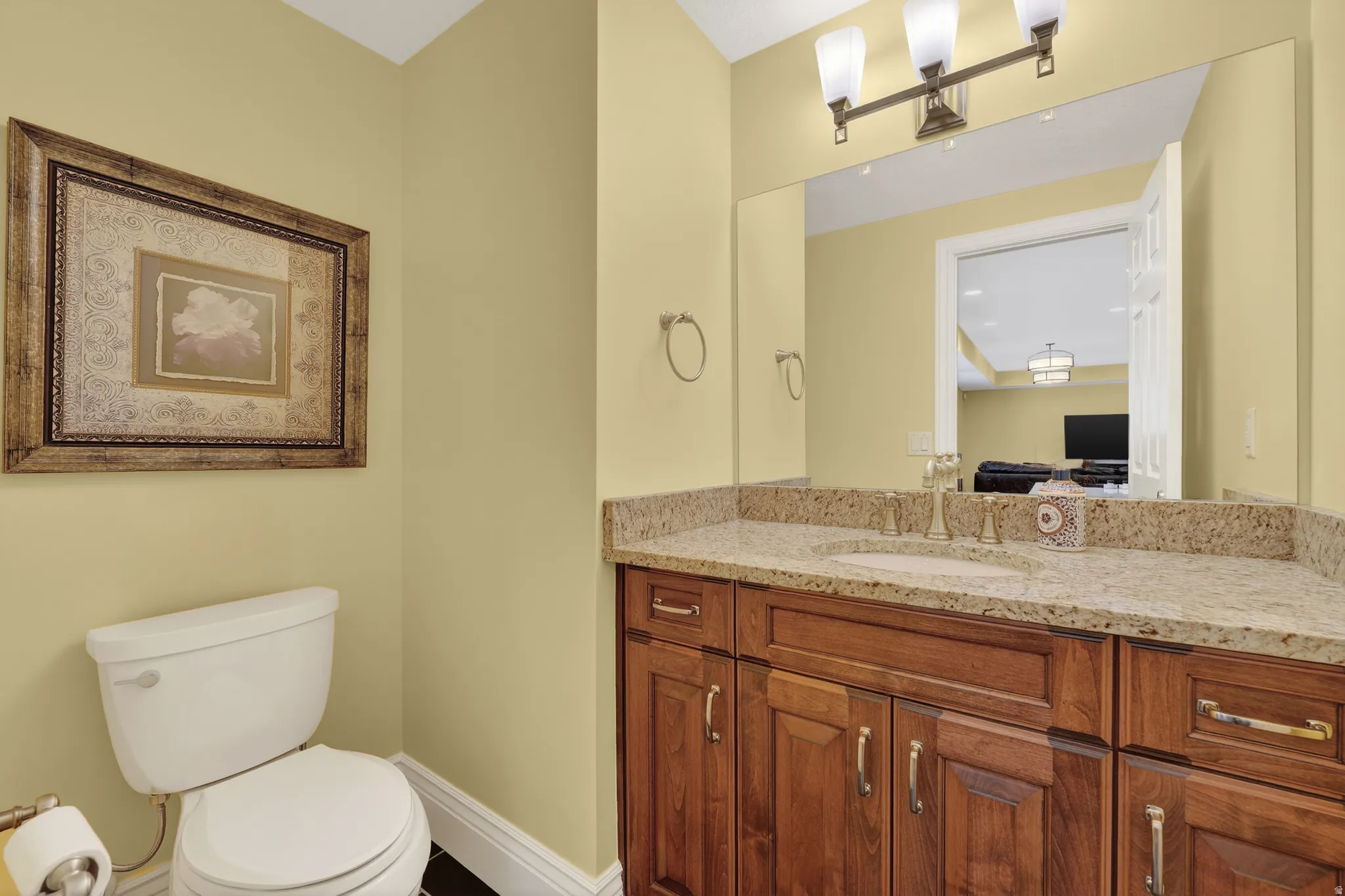 Bathroom featuring vanity and toilet