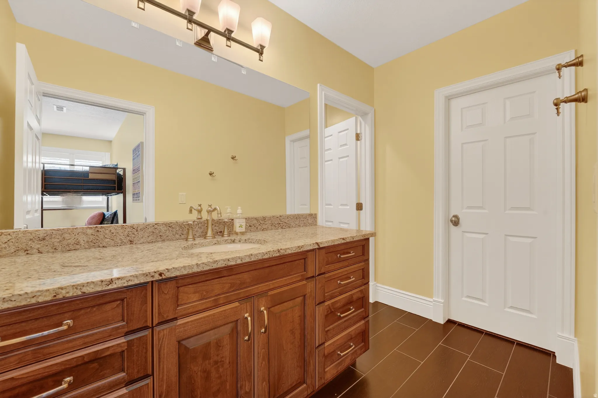 Bathroom with vanity and baseboards