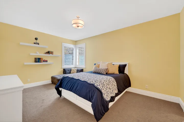 Bedroom with corner windows and en-suite bathroom