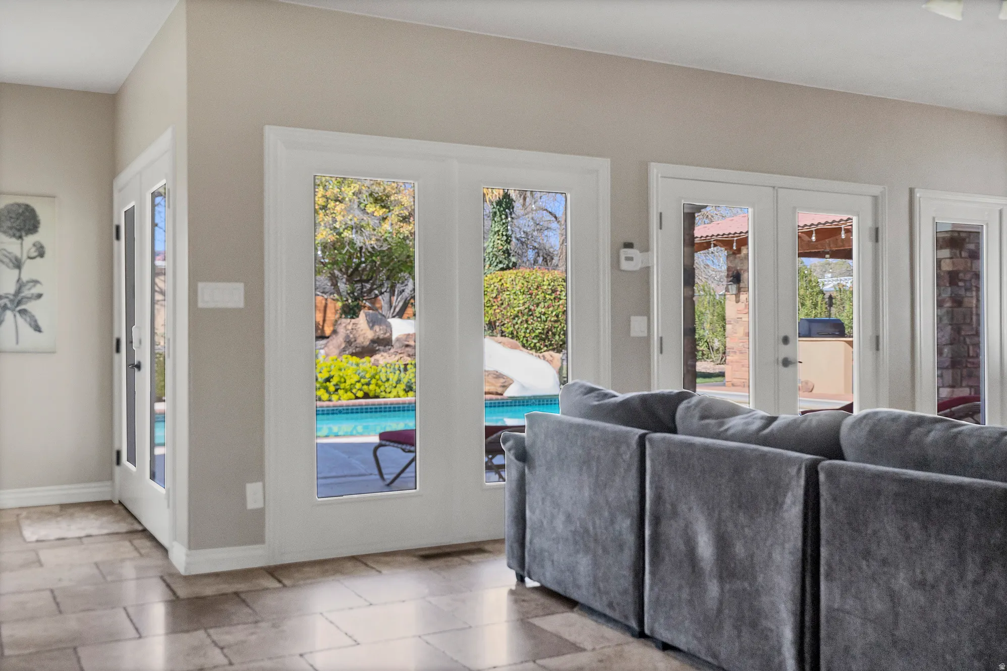 Living area featuring french doors and healthy amount of natural light