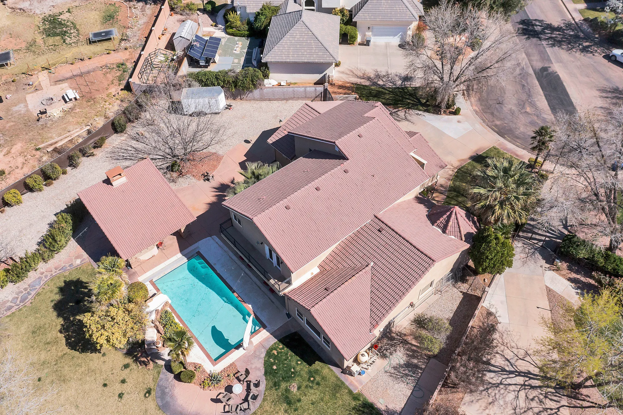 Aerial view of residential area featuring a pool area