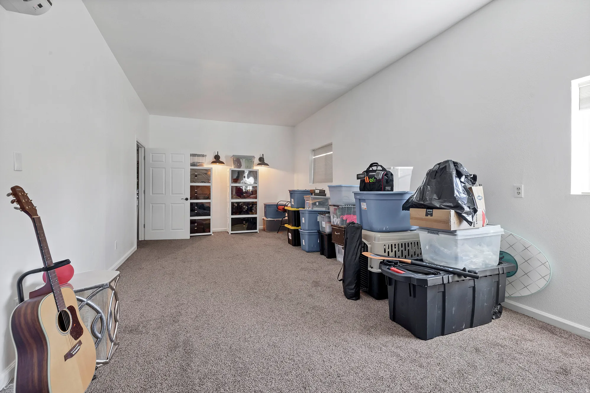 Interior space featuring light carpet and baseboards