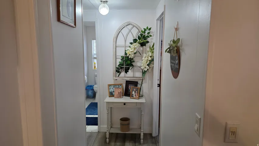 Entrance foyer featuring wood finished floors