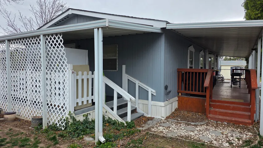 View of exterior entry featuring a porch