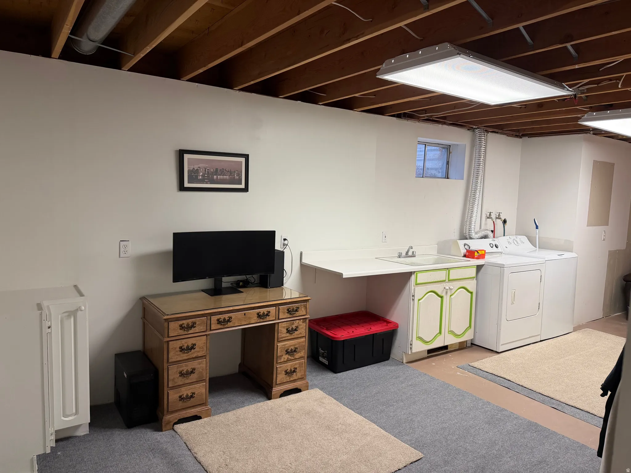 Laundry room with washing machine and clothes dryer and cabinet space
