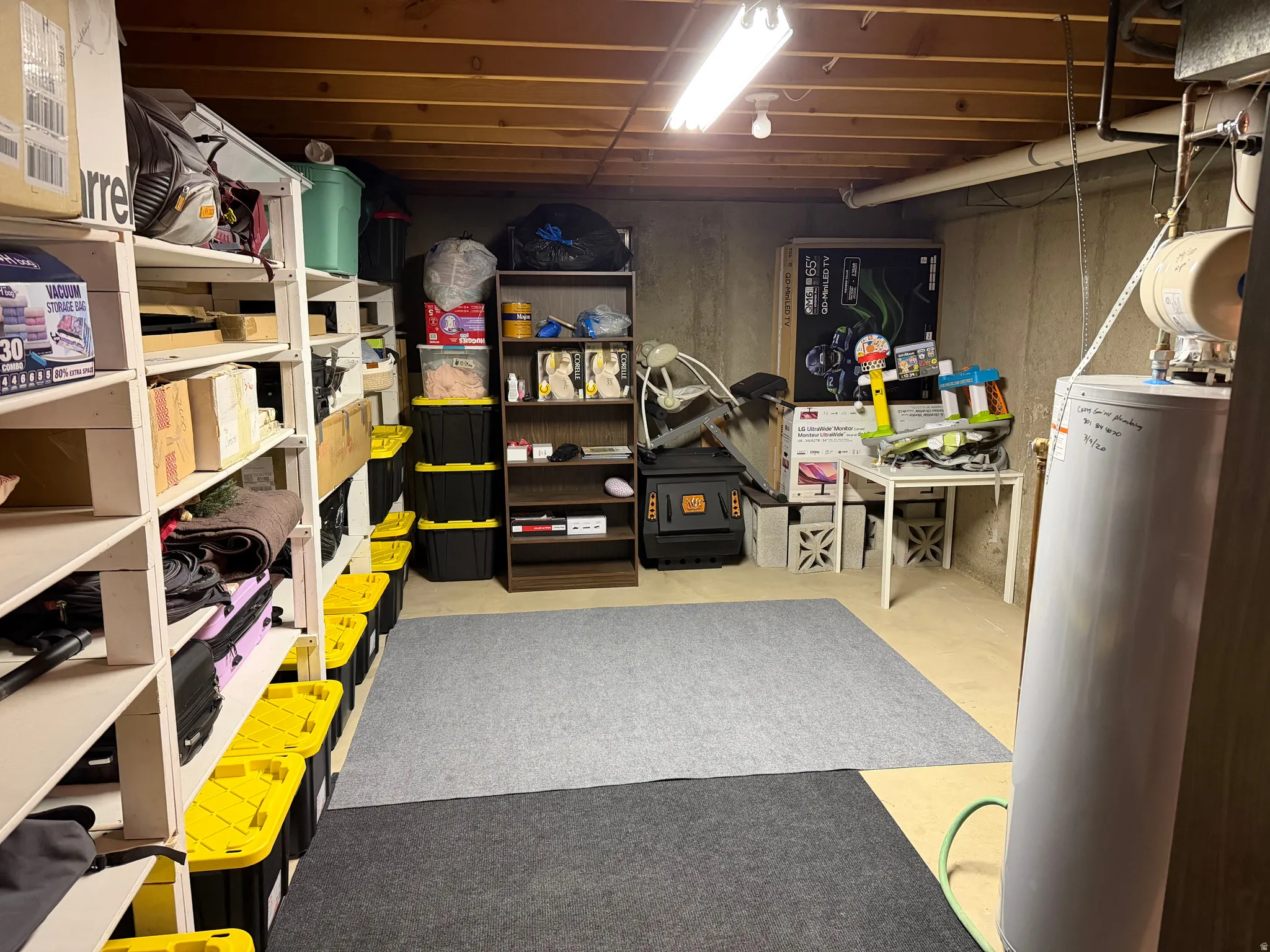 Storage area featuring water heater