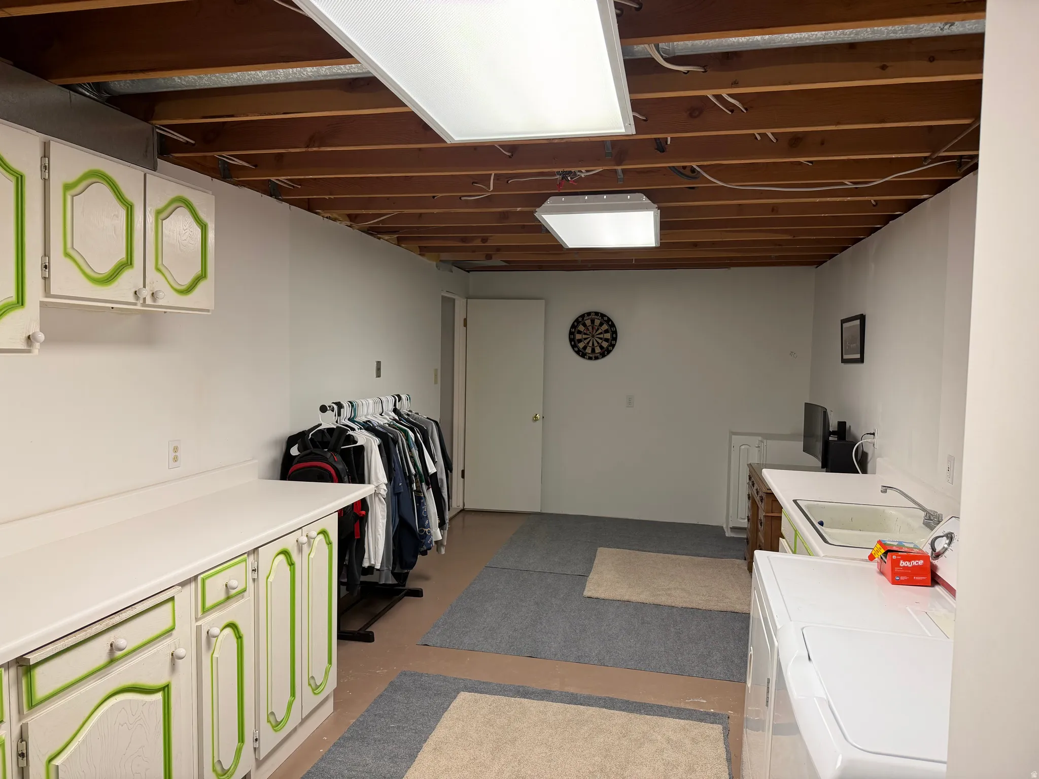 Laundry room featuring cabinet space and separate washer and dryer