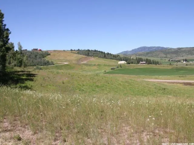 View of mountain background featuring rural landscape