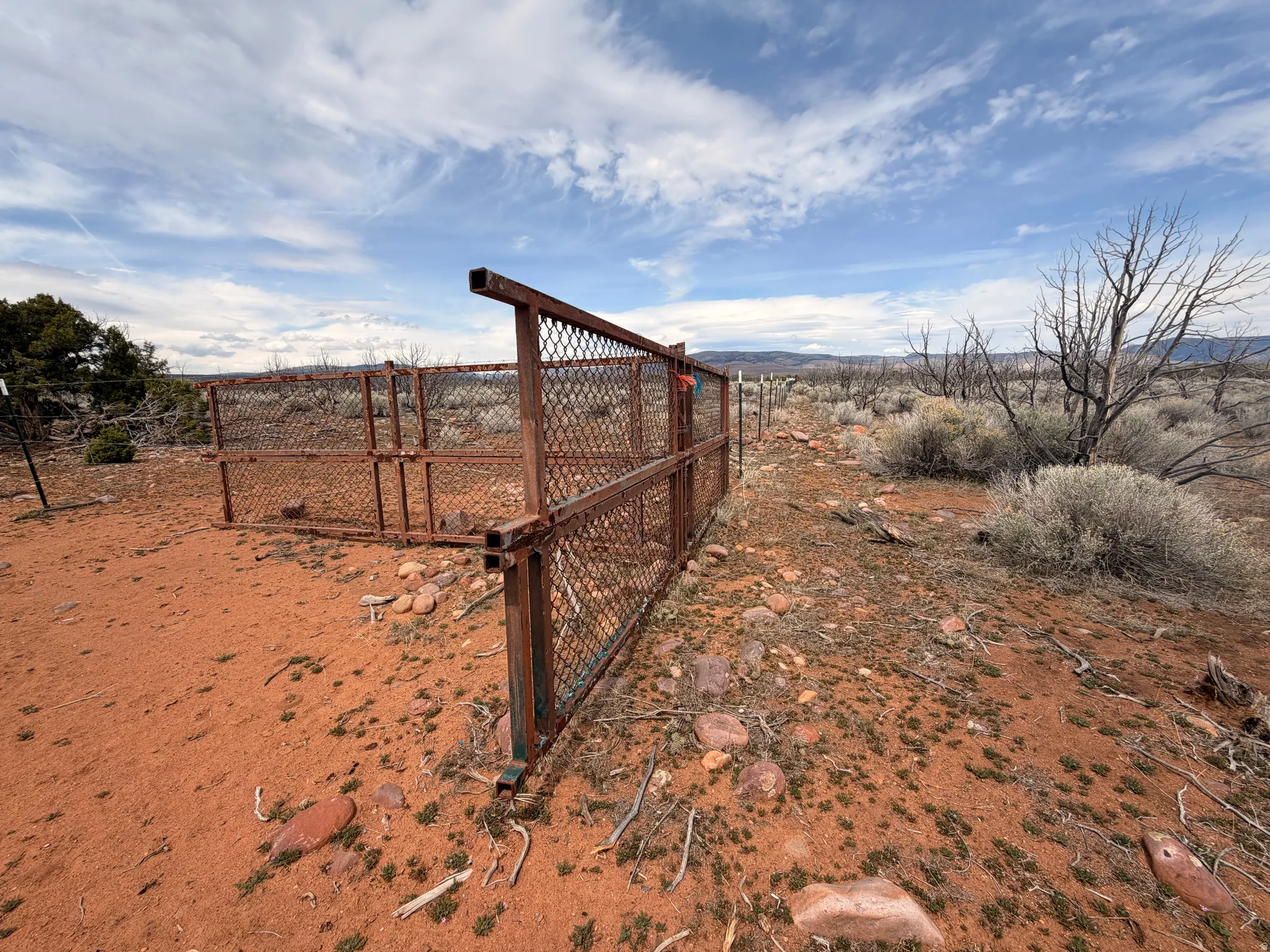 View of yard featuring a gate and a rural view
