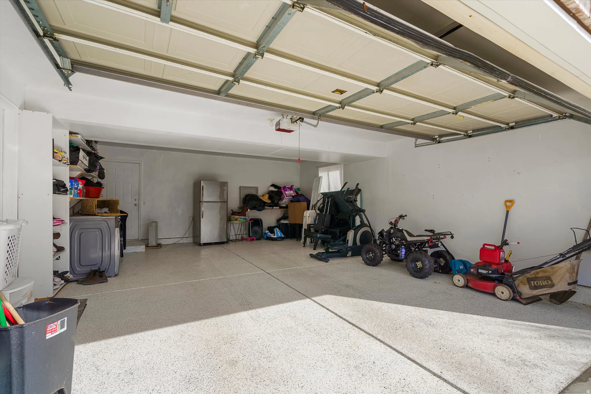 Garage with freestanding refrigerator