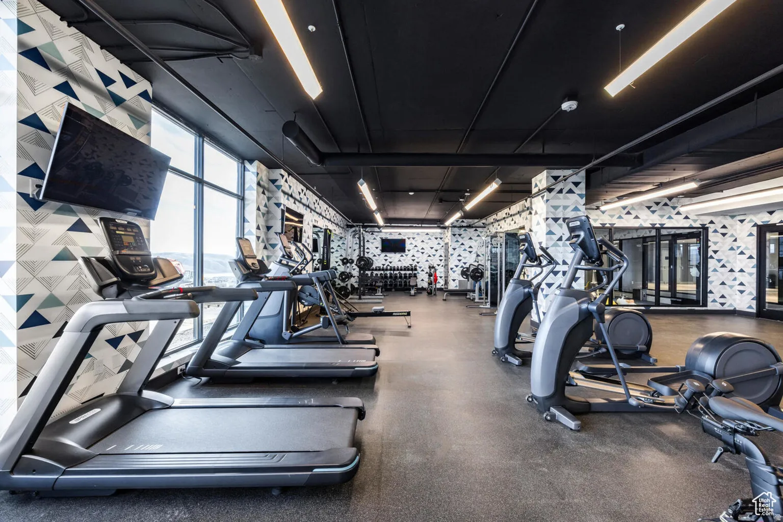 Workout area with wallpapered walls