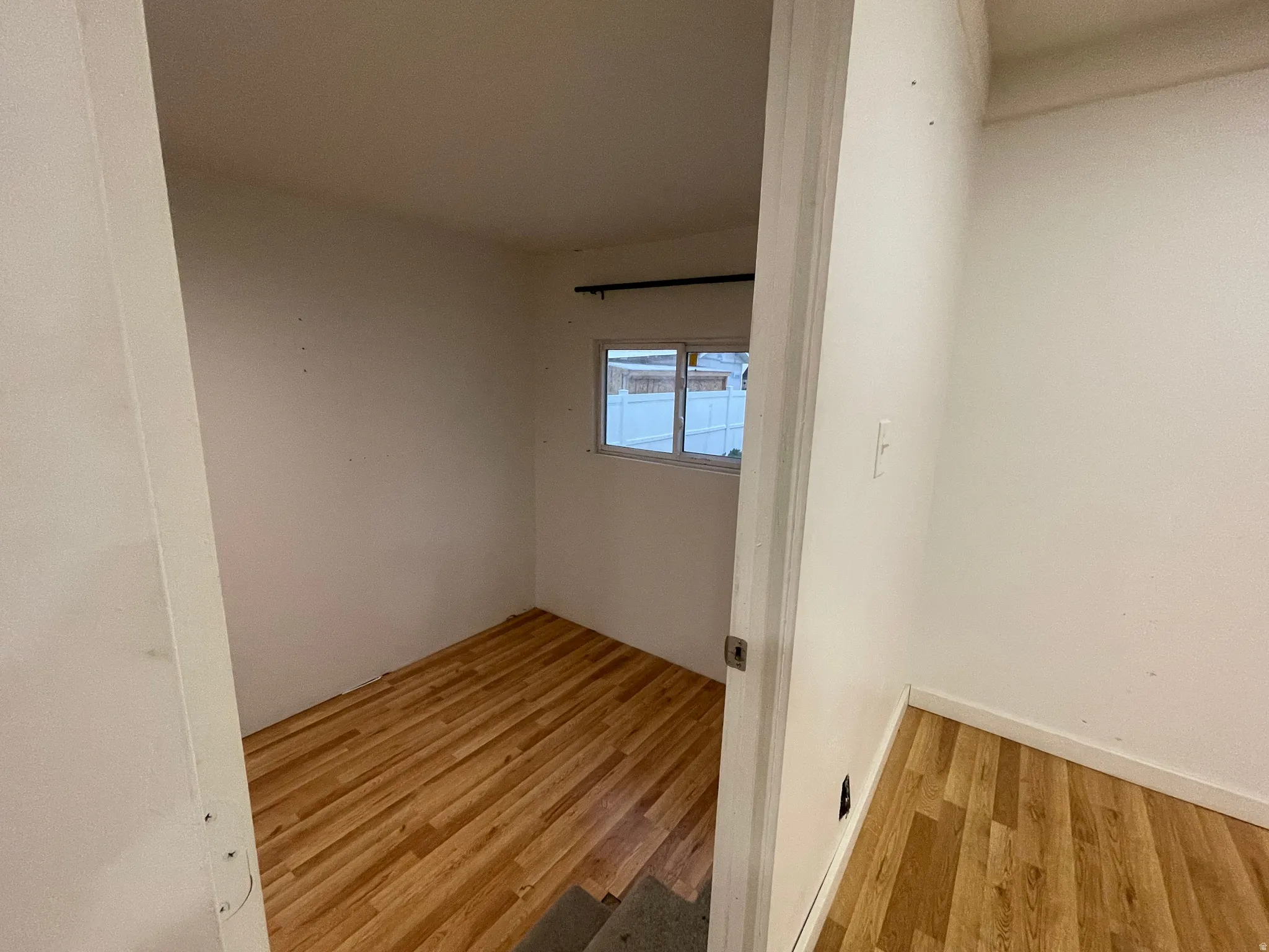 Spare room with light wood-style flooring