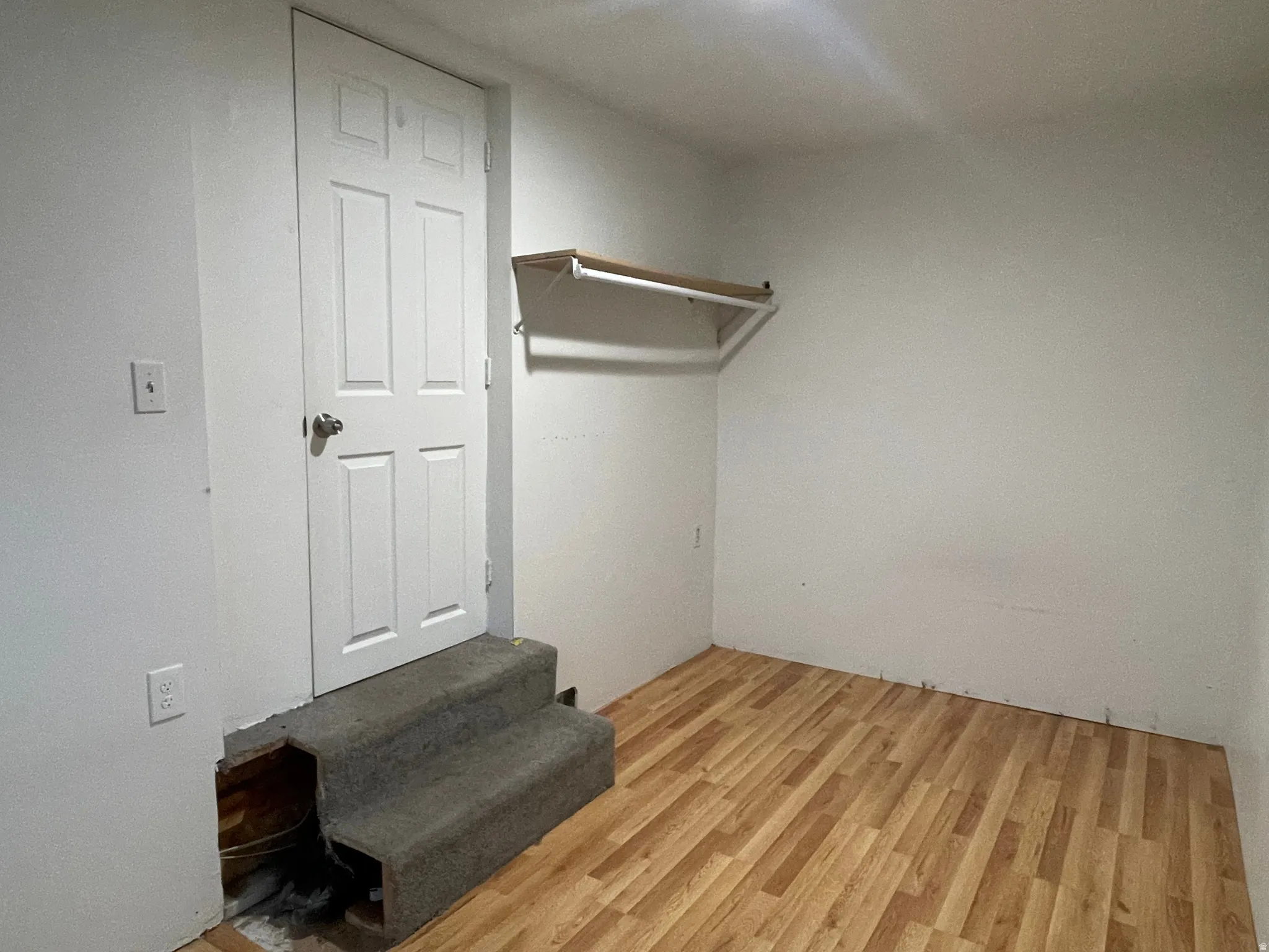 Walk in closet featuring light wood-style floors