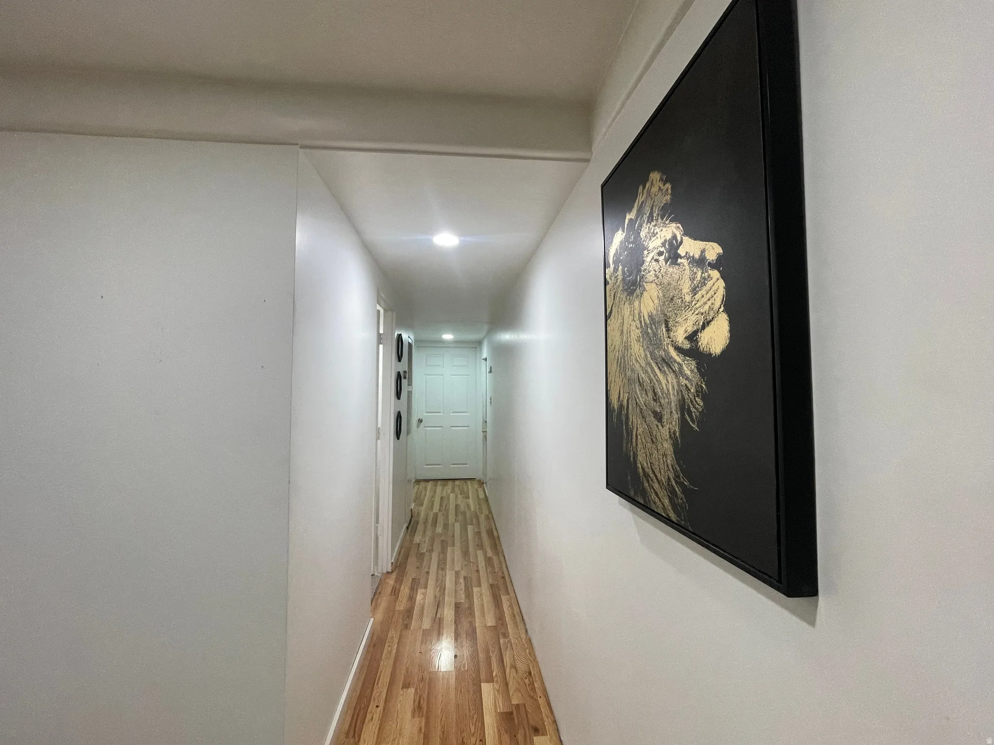 Hallway featuring recessed lighting and light wood-type flooring