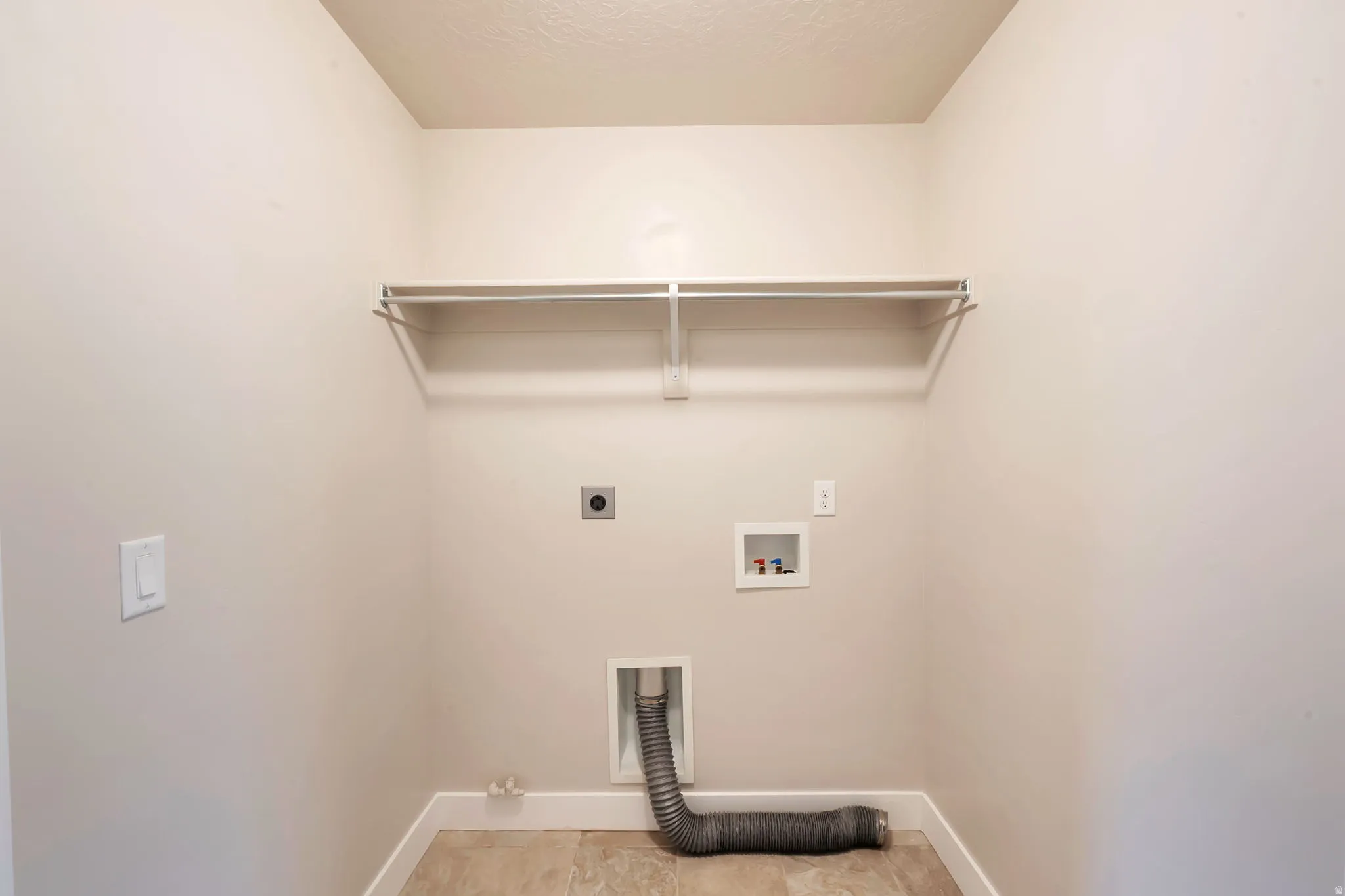 Laundry room with electric and gas dryer hookup