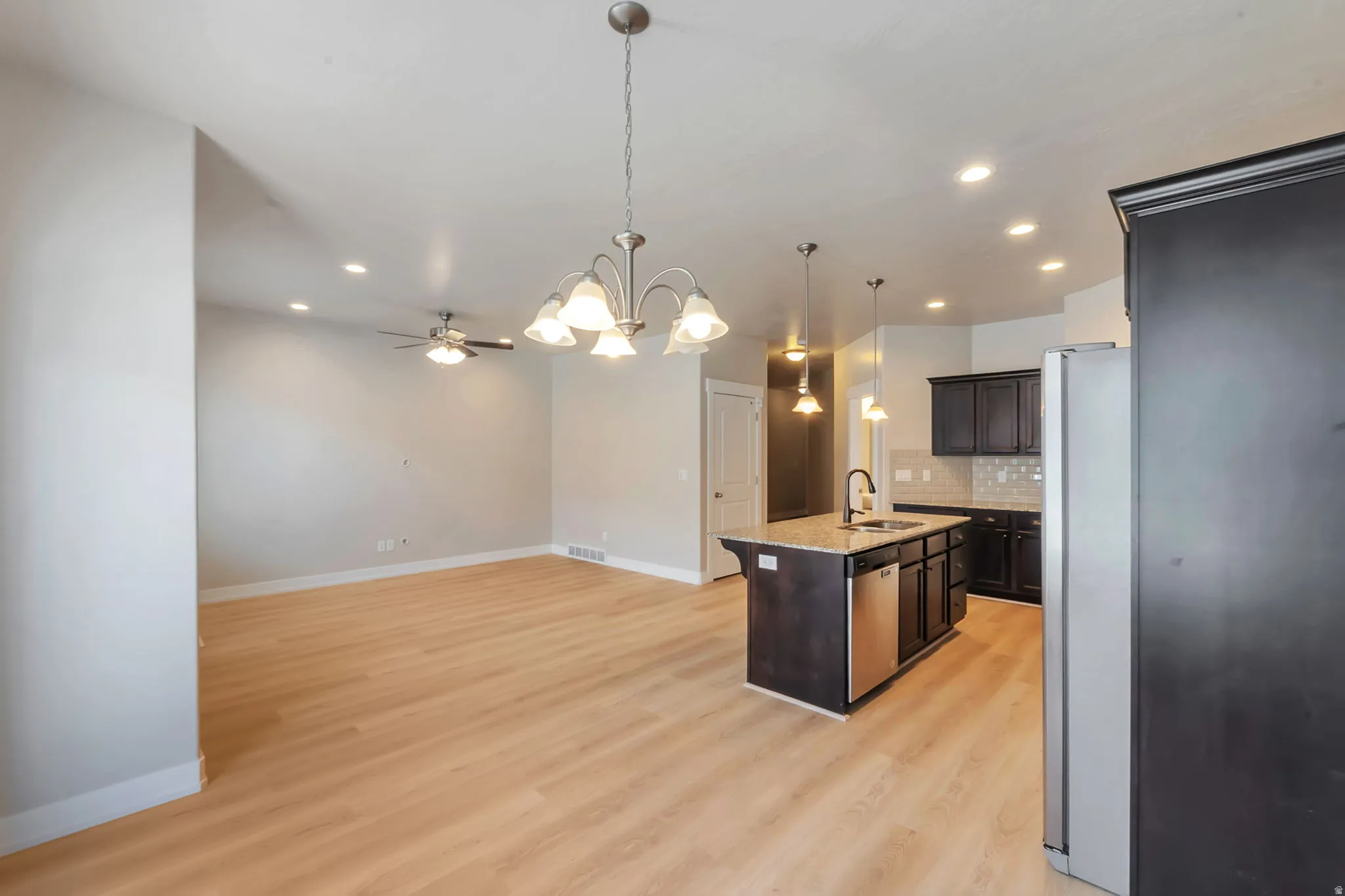 Kitchen with Island, stainless steel appliances and new LVP flooring
