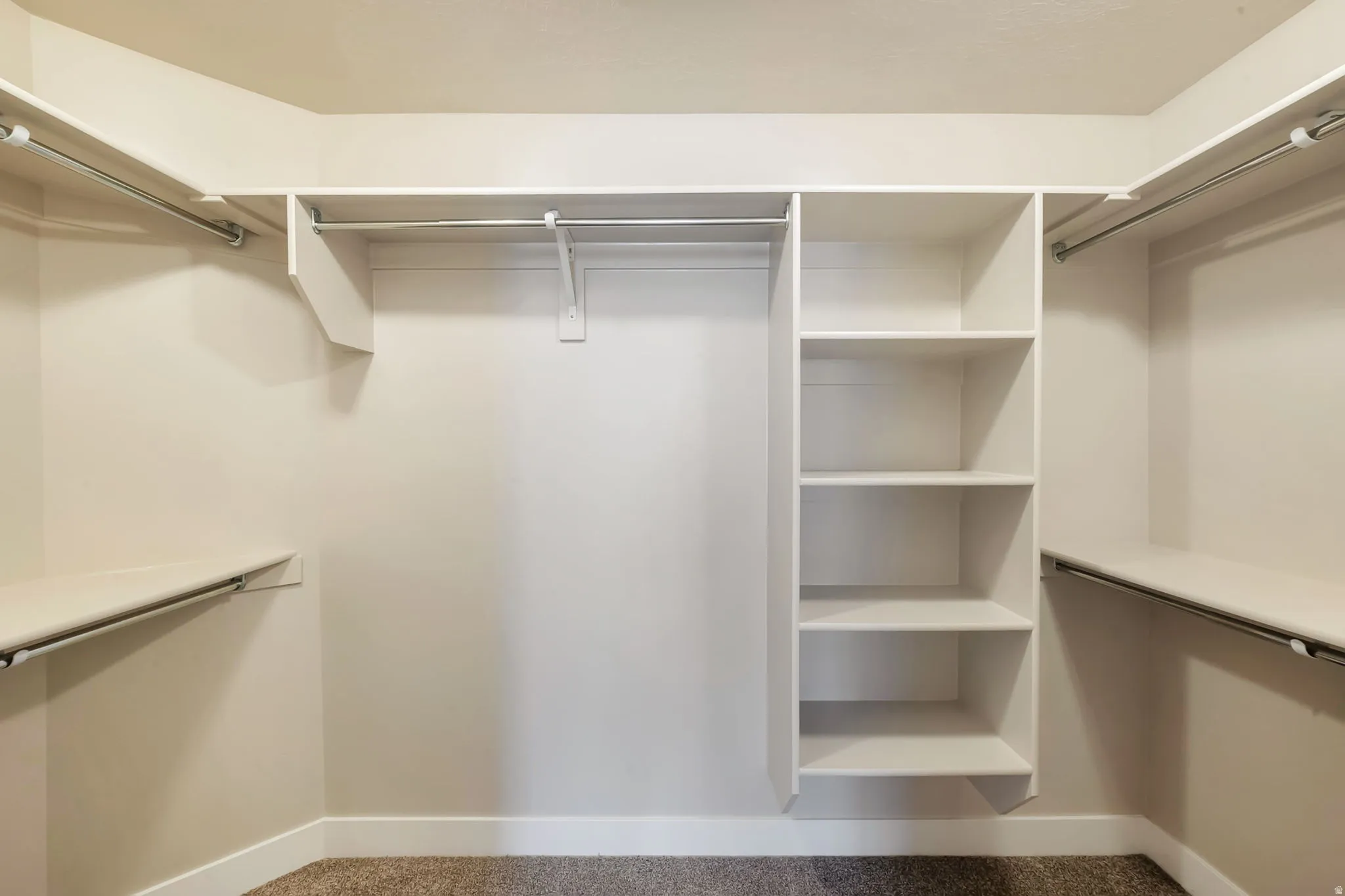 Primary bedroom walk-in closet