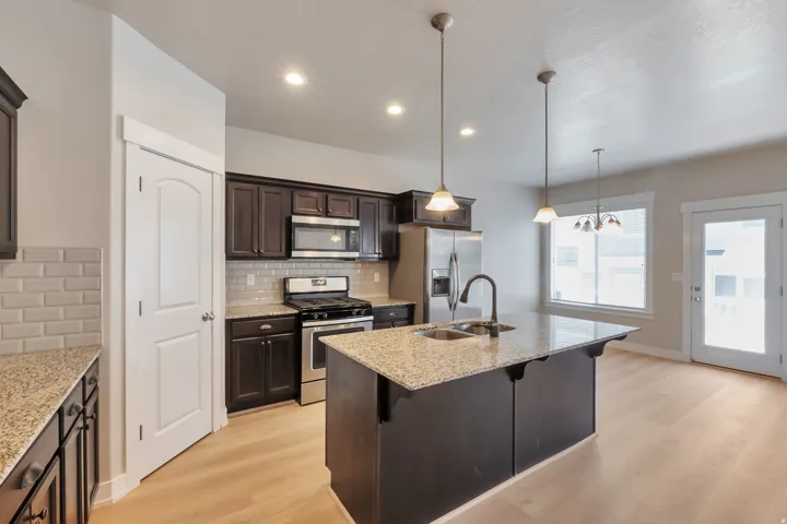 Kitchen with Island, stainless steel appliances and new LVP flooring