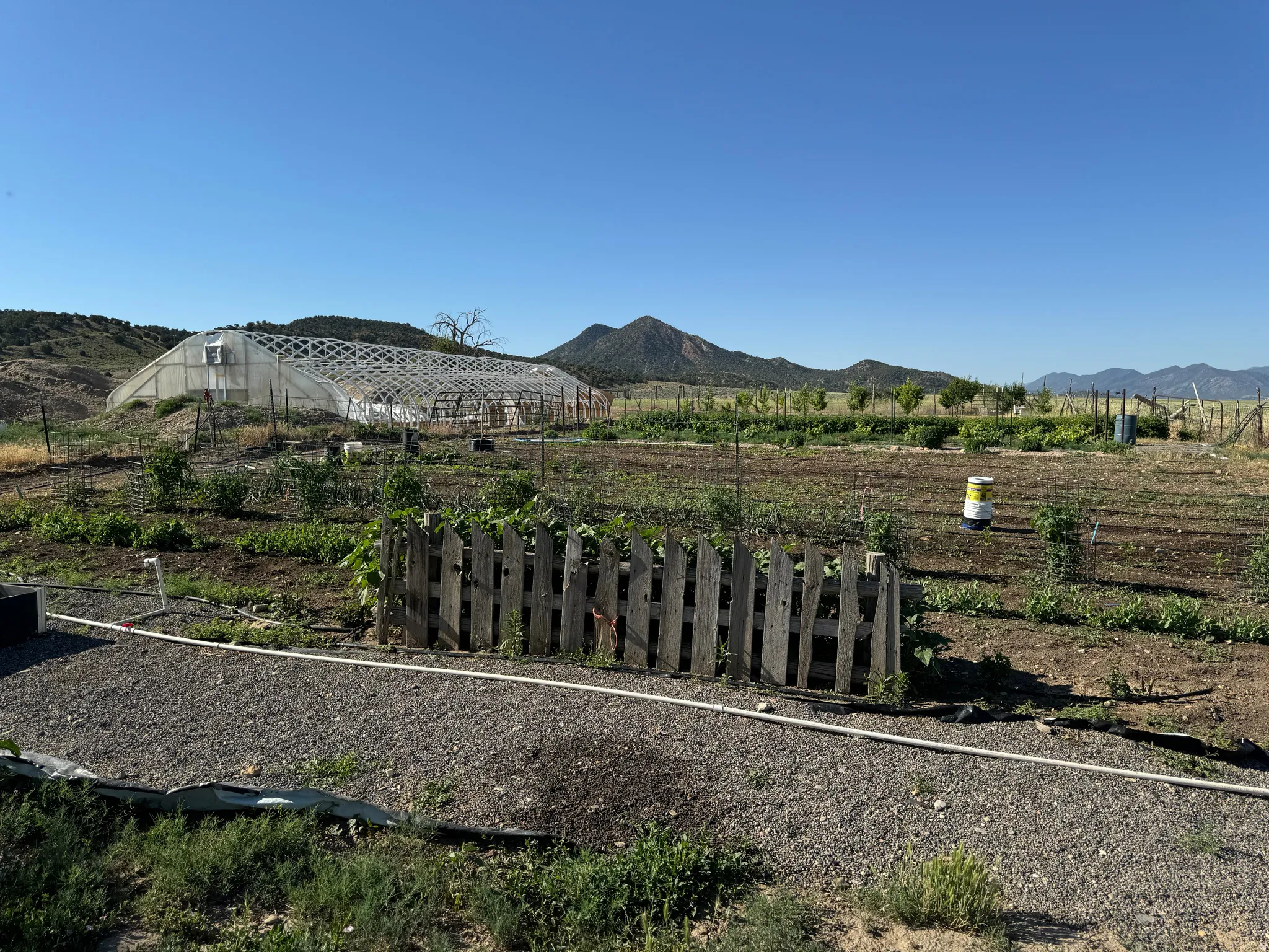 View of mountain backdrop with rural landscape