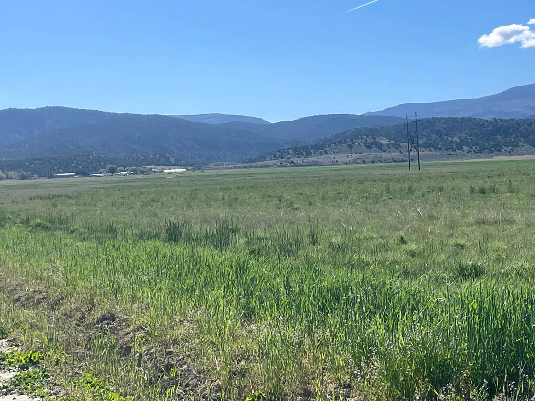 View of mountain background featuring rural landscape