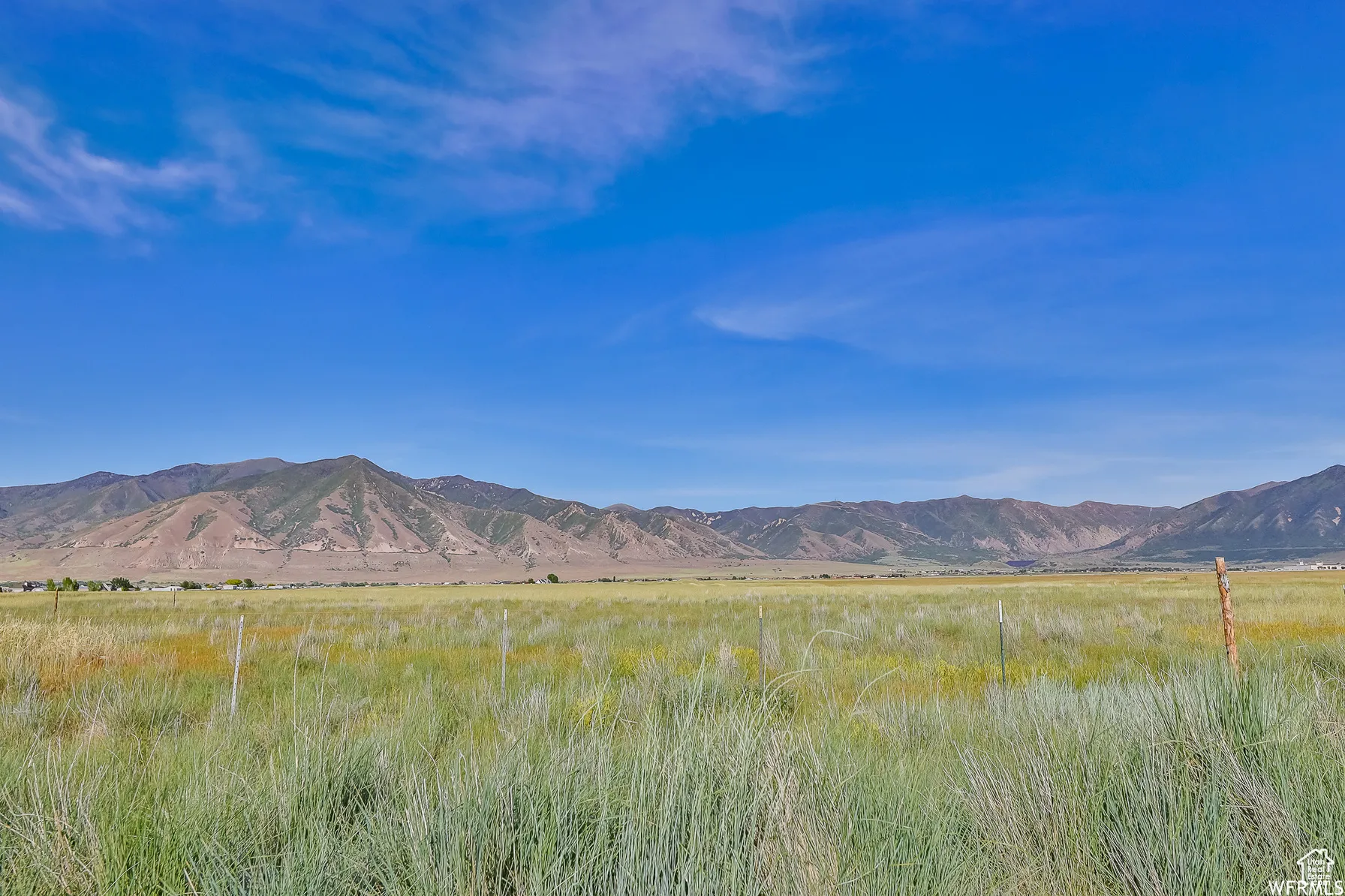 View of mountain backdrop featuring rural landscape