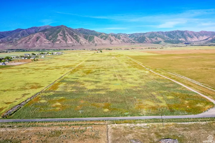 View of mountain backdrop with rural landscape